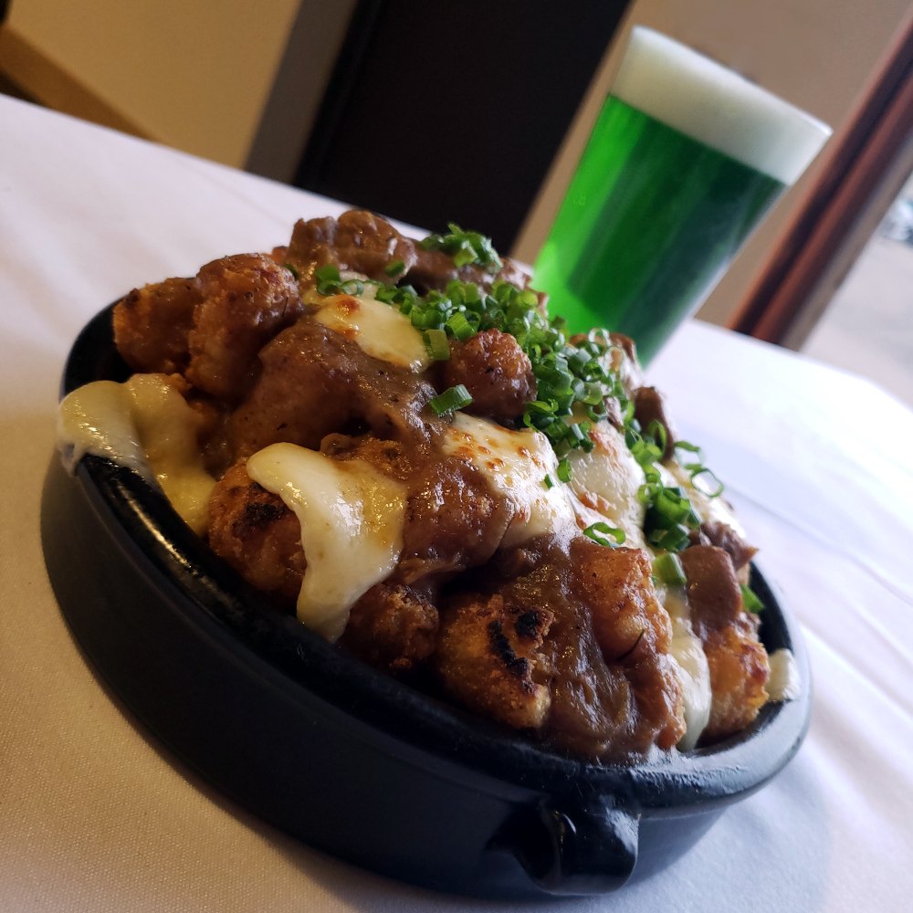lamb poutine with green beer